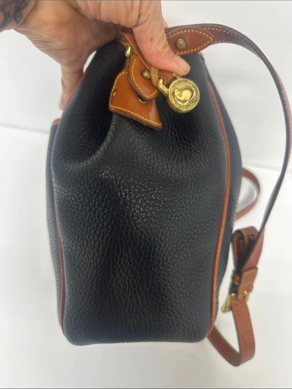 Dooney & Bourke Black Pebbled Leather Drawstring Bucket Bag with Tan Trim